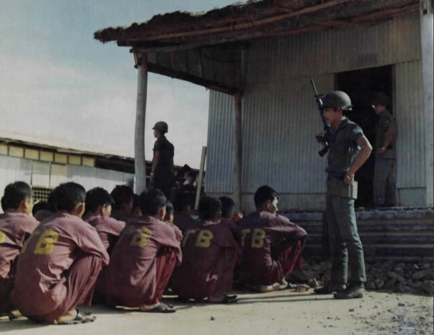 The POWs sitting in line to be classified at the Phu Quoc Coconut Prison camp