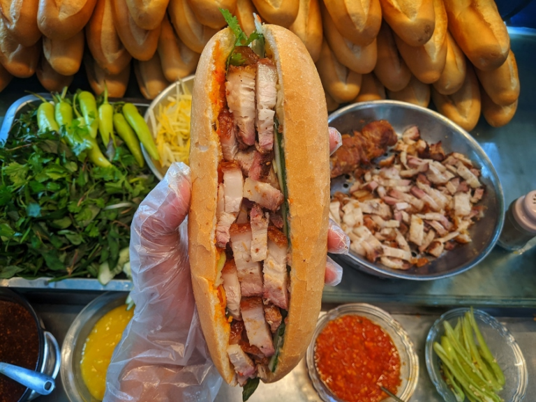 Grilled meats, cold cuts, fresh herbs and pickled veggie add up a savory taste to Banh Mi