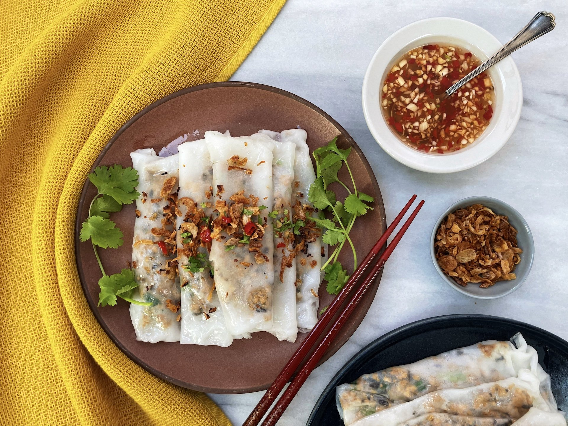 Vietnamese Vegetarian Banh cuon is stuffed with crumbled tofu and served with dipping sauce