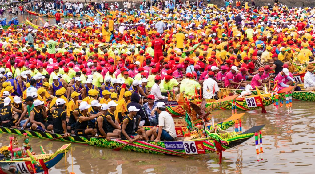 Serpent-shaped boats powered by 40-50 rowers race in unison to honor the Water God