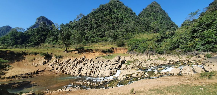 You should go to Nam Tra Waterfall because it's beautiful and quiet, and it's a great place to get away from busy tourist spots.