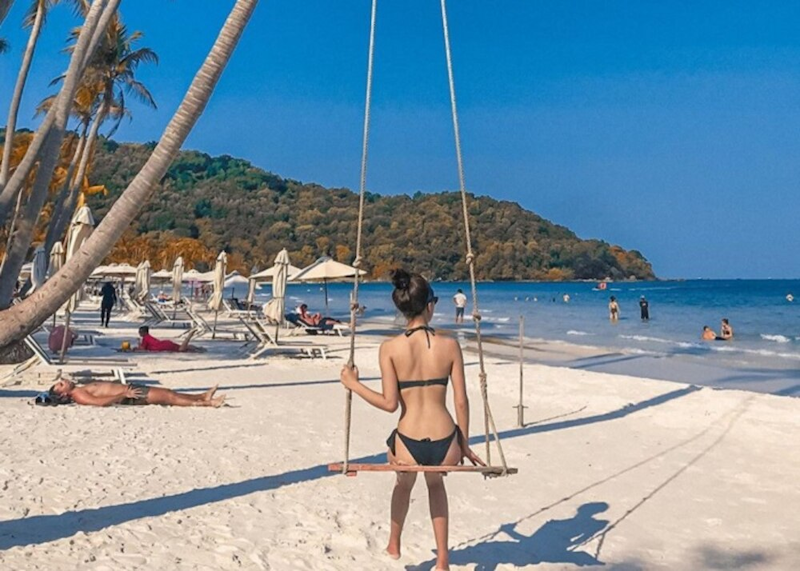 Swimming and relaxing on the white sand
