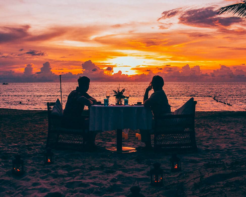 Watch the sunset and walk on the beach in the evening