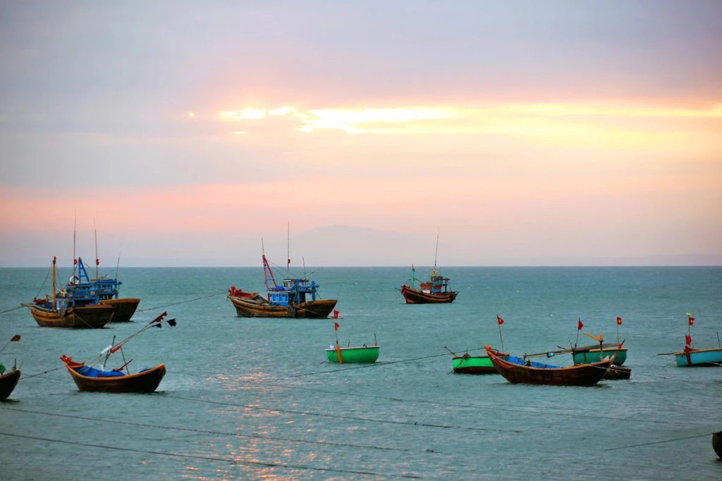 Fishermen's boats are fishing off Ham Ninh Beach