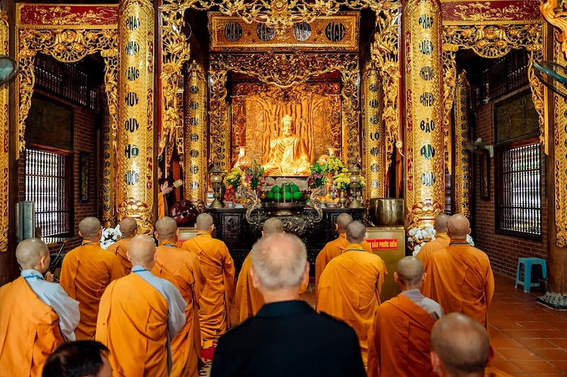 The monks are performing solemn Buddhist rituals