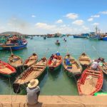 Wooden boats of fishermen are gathering to fish for fish and squid