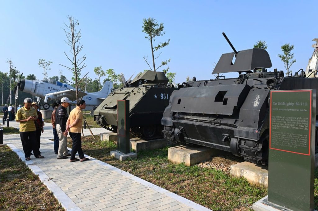 Outdoor area, displaying war artifacts with many versions of tanks, armored vehicles, and airplanes