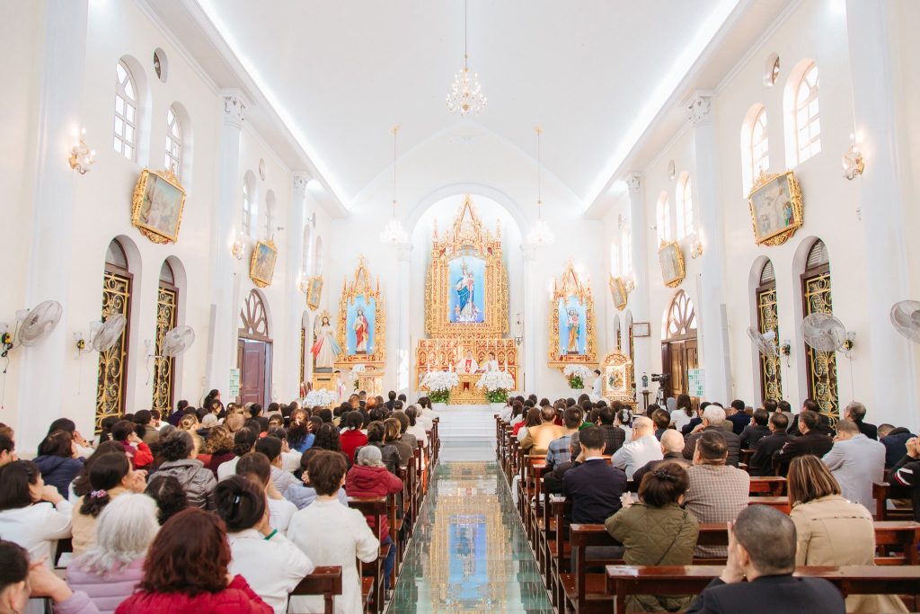 The solemn atmosphere inside Hon Gai Church during religious services