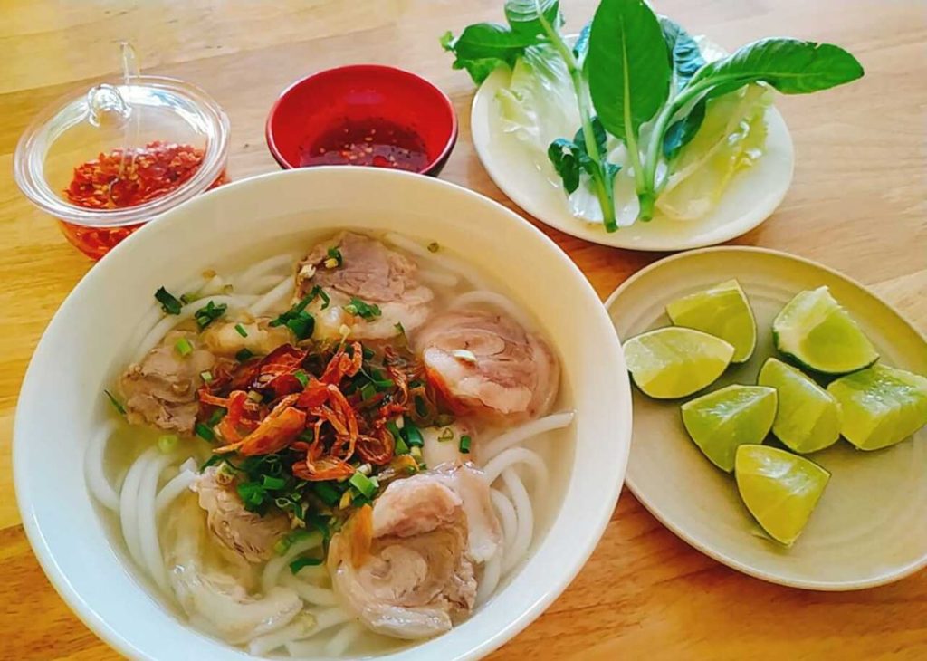 Visitors should enjoy Trang Bang rice noodle soup in the morning