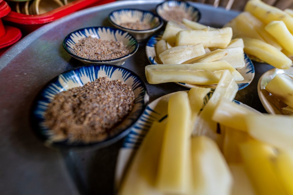 Steamed Tapioca (Khoai mì) served with a mix of salt, sugar and crushed peanuts.