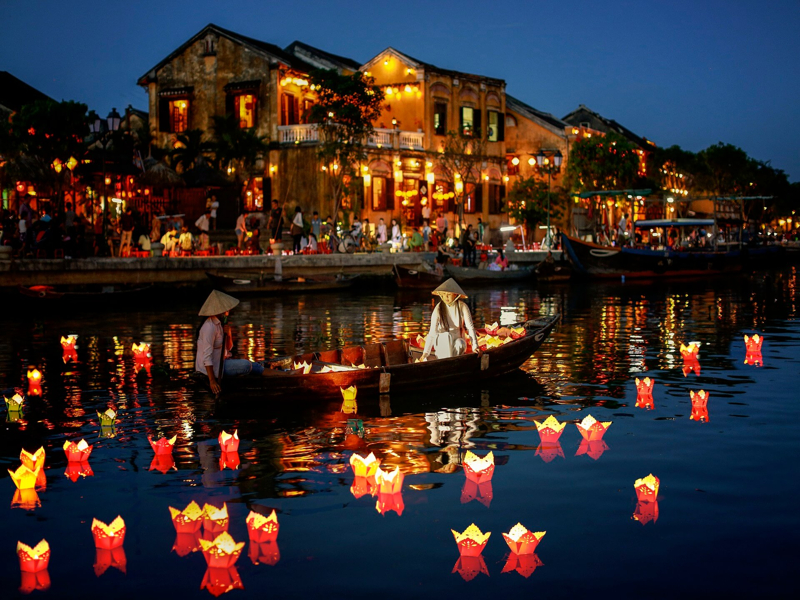 Release a small paper lantern into the Hoai River for good luck in Hoi An