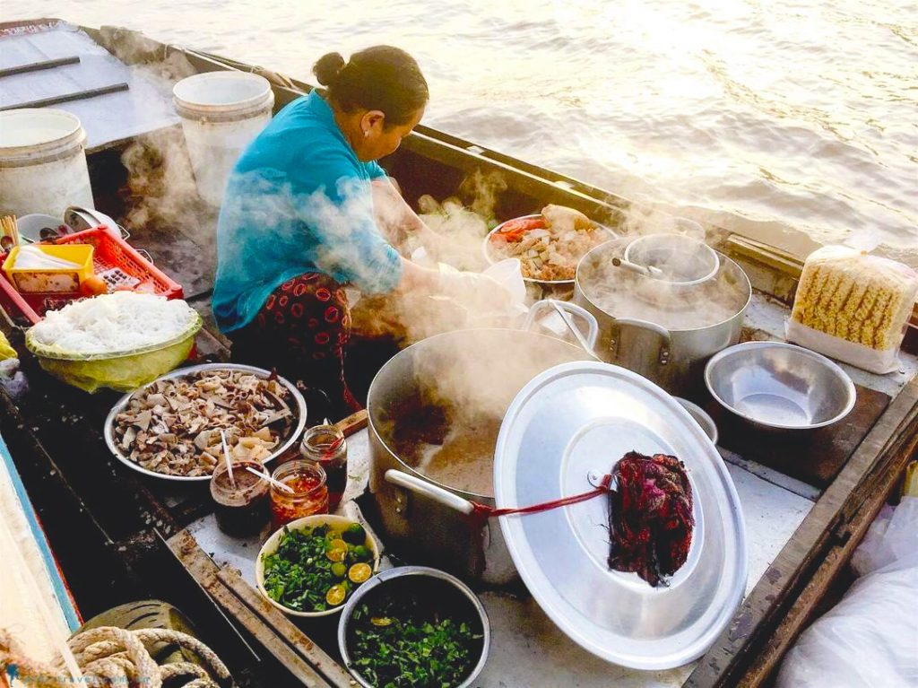 You can even grab a hot bowl of Hu Tieu (noodle soup) directly from a passing "floating kitchen”