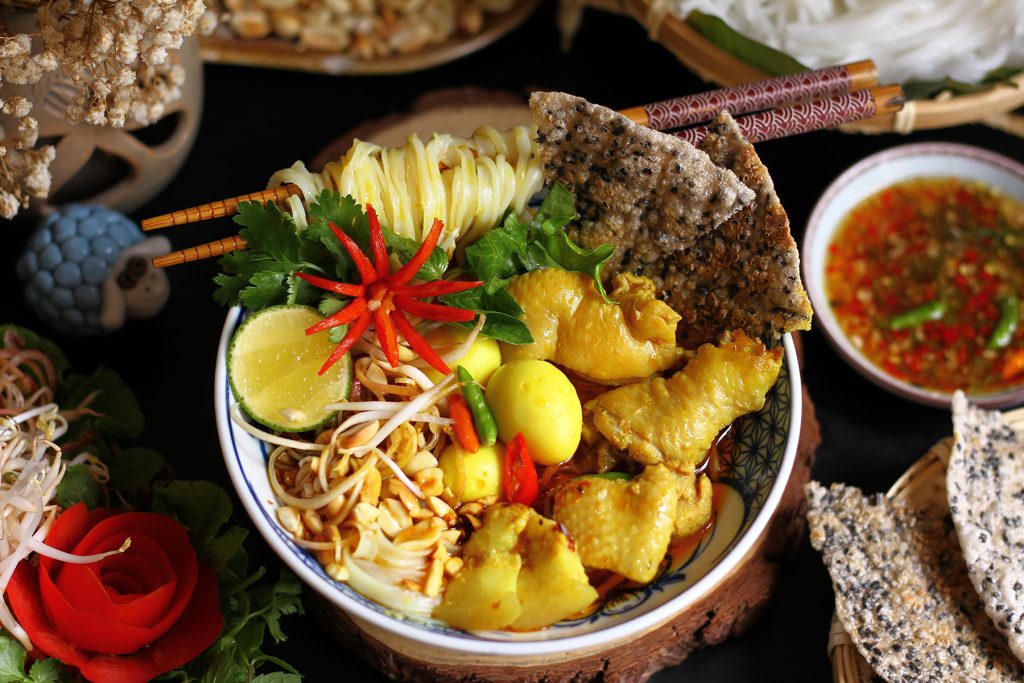 Mì Quảng  (turmeric-infused rice noodles)