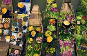 Floating markets are a dawn affair, where boat to boat trading reaches its peak at sunrise before largely fading away by mid morning.