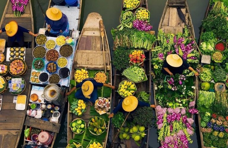 Floating markets are a dawn affair, where boat to boat trading reaches its peak at sunrise before largely fading away by mid morning.