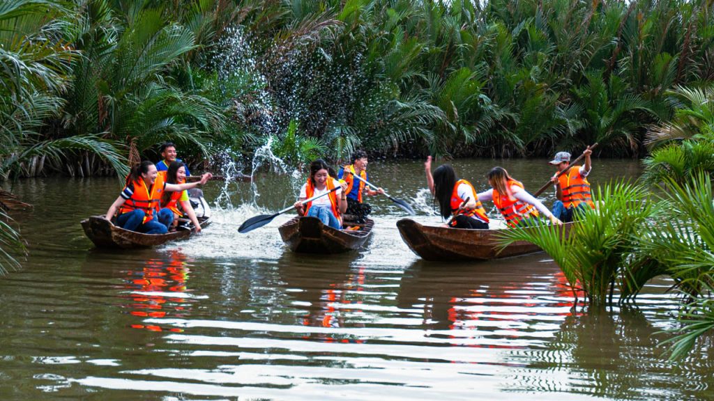 Glide through the canals in a wooden sampan