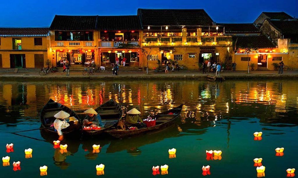 Spend two evenings wandering Hoi An's lantern lit merchant streets