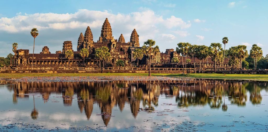 Standing before the monumental, stone carved towers of Angkor Wat offers a profound historical contrast