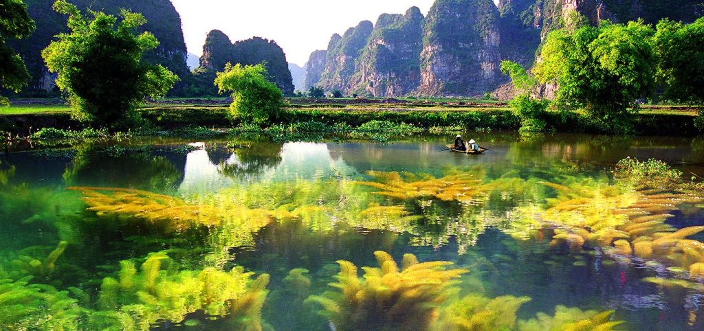 Ninh Binh, often called "Halong Bay on land", where you will take a peaceful sampan ride through winding rivers flanked 