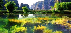 Ninh Binh, often called "Halong Bay on land", where you will take a peaceful sampan ride through winding rivers flanked